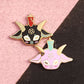 Two colorful enamel pins on a pink and black background